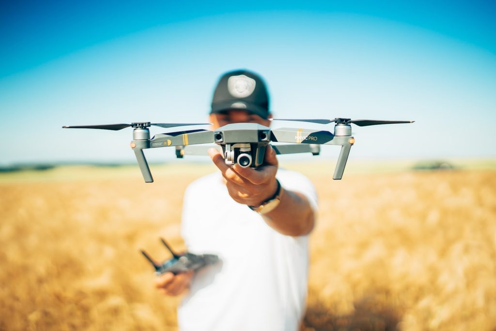 Drone Surveyor - shallow focus photography of quadcopter