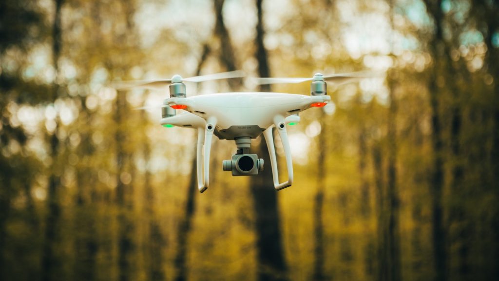 DJI Phantom 4 Pro : white drone flying during daytime