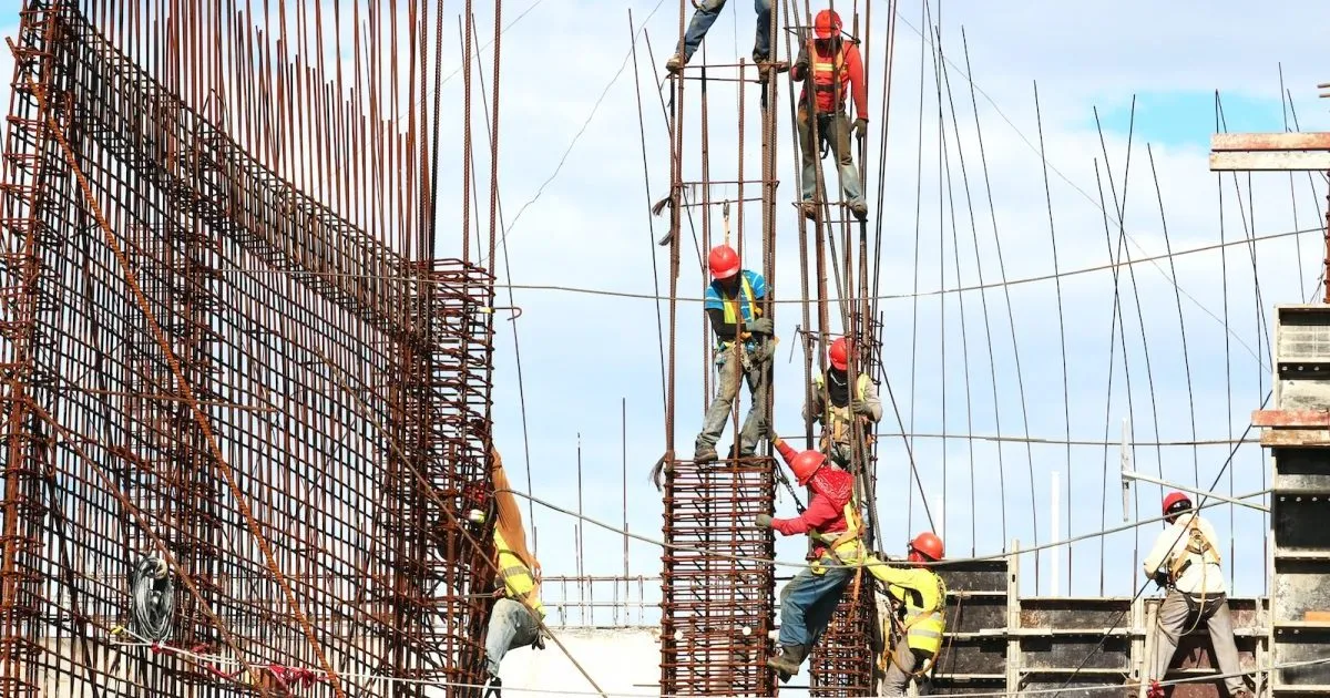 people working on building during daytime